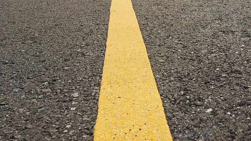 solid yellow line on road